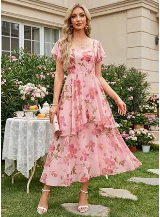 Klänning Midi i Chiffong med Blomtryck